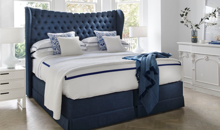 Blue-bed Royal blue divan bed with luxurious buttoned upholstered headboard