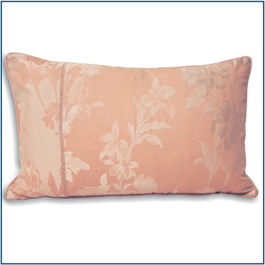 Pink cushion cover with shiny, delicate floral design