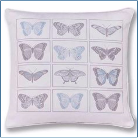 White cushion cover with blue and grey butterflies