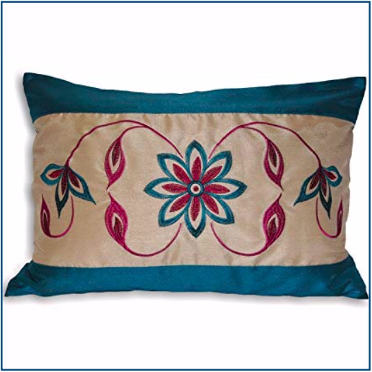 Rectangular, teal cushion cover with teal and purple flower and leaf pattern.