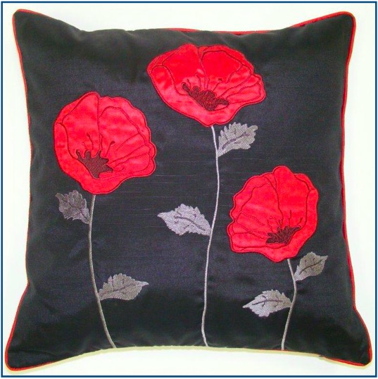 Black cushion cove with three red poppies