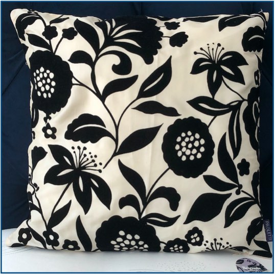 Ivory cushion cover with black velvet floral design